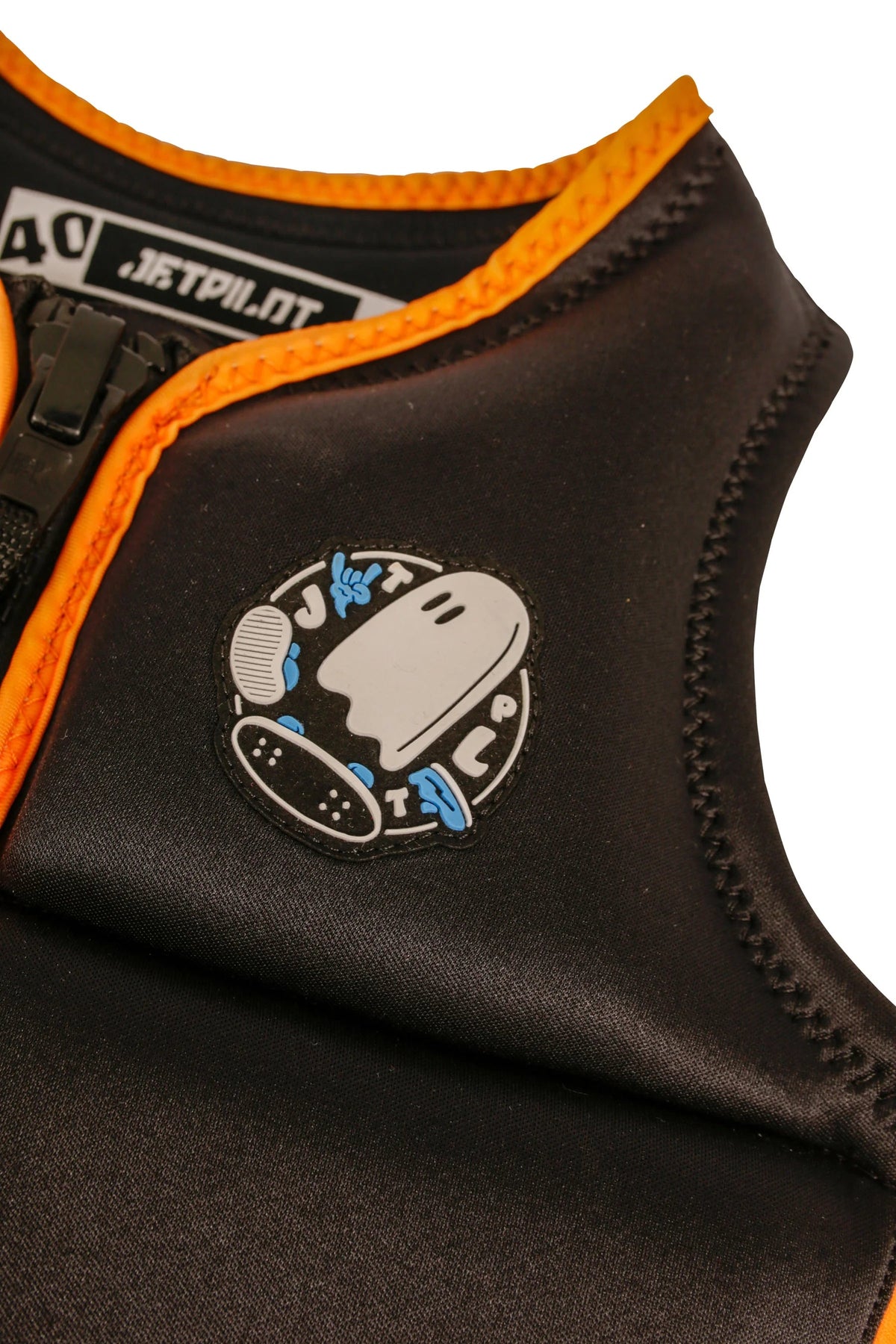 Close-up of the skateboarding ghost patch and 40 tab collar label on the Black Freeride Boys