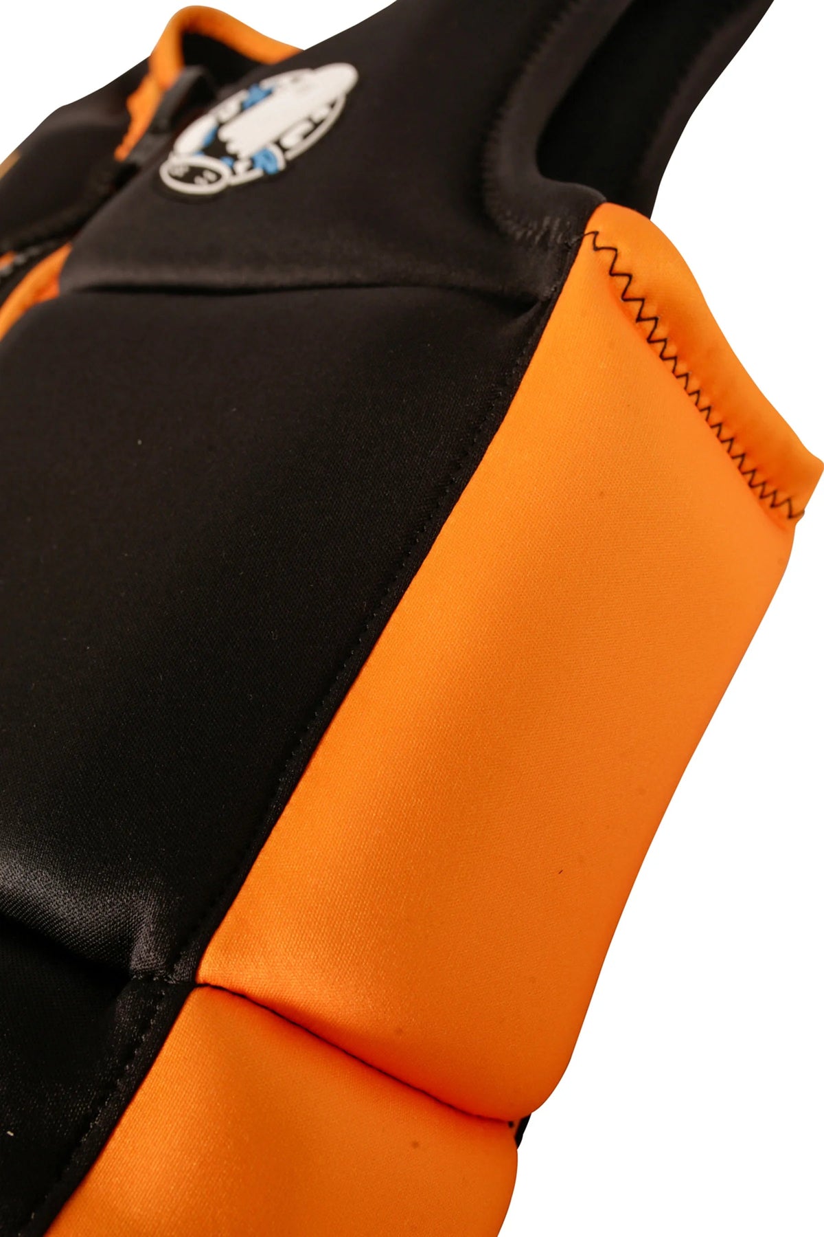 Close-up of the orange side panel and stitched foam on the Black Freeride Boys