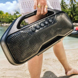 Sea-Doo BRP portable audio speaker carried by its handle for use ashore